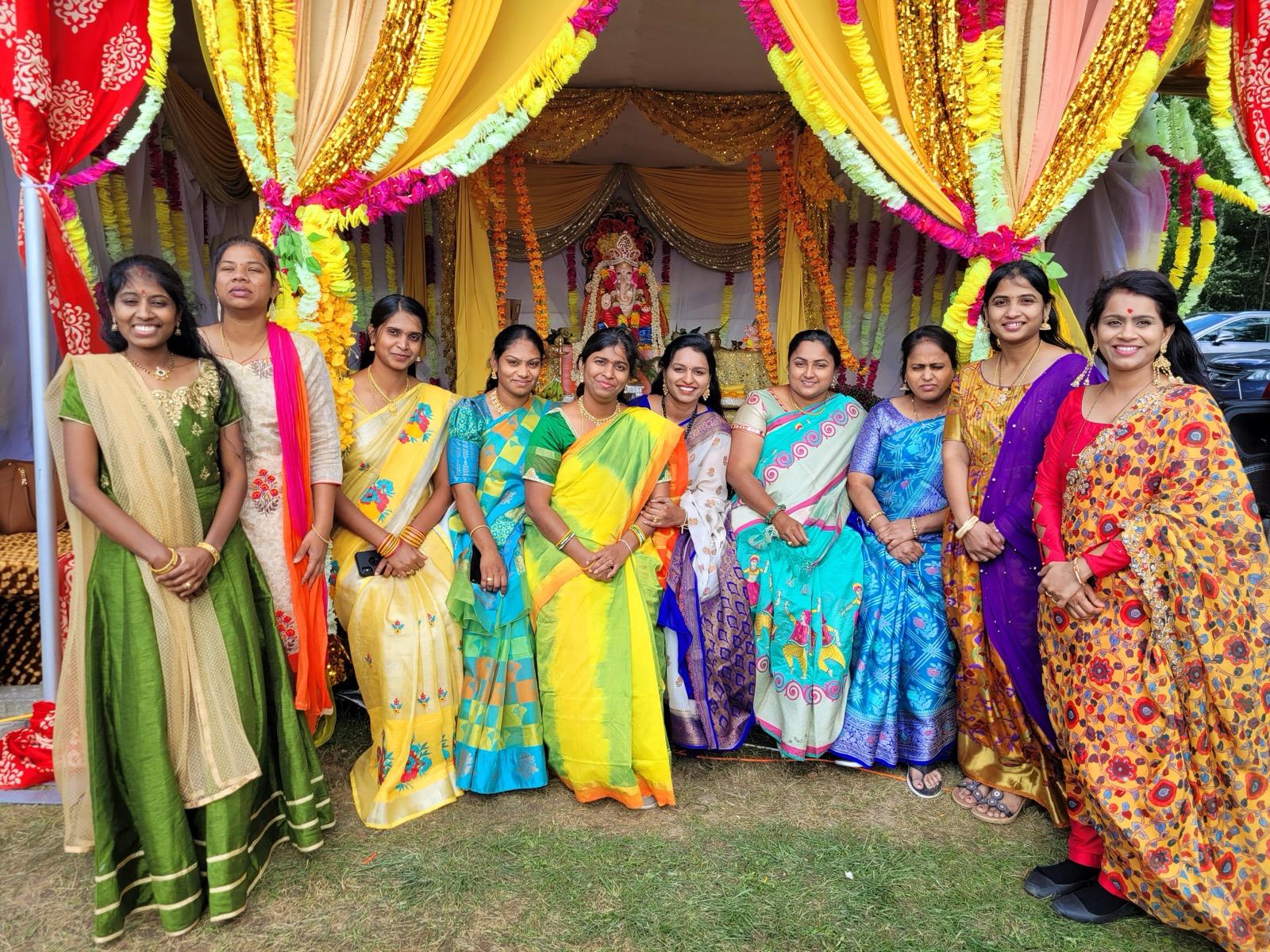 Women of the Telugu Friends Club community in colourful sarees at the decorated Ganesh mandap, 2021