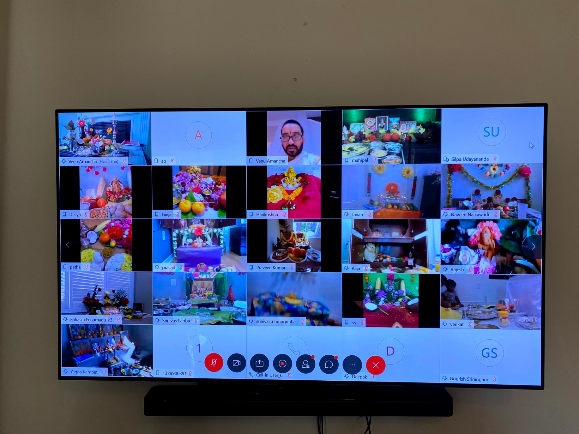 Virtual gathering grid showing many families celebrating Ganesh Pooja from home, 2020