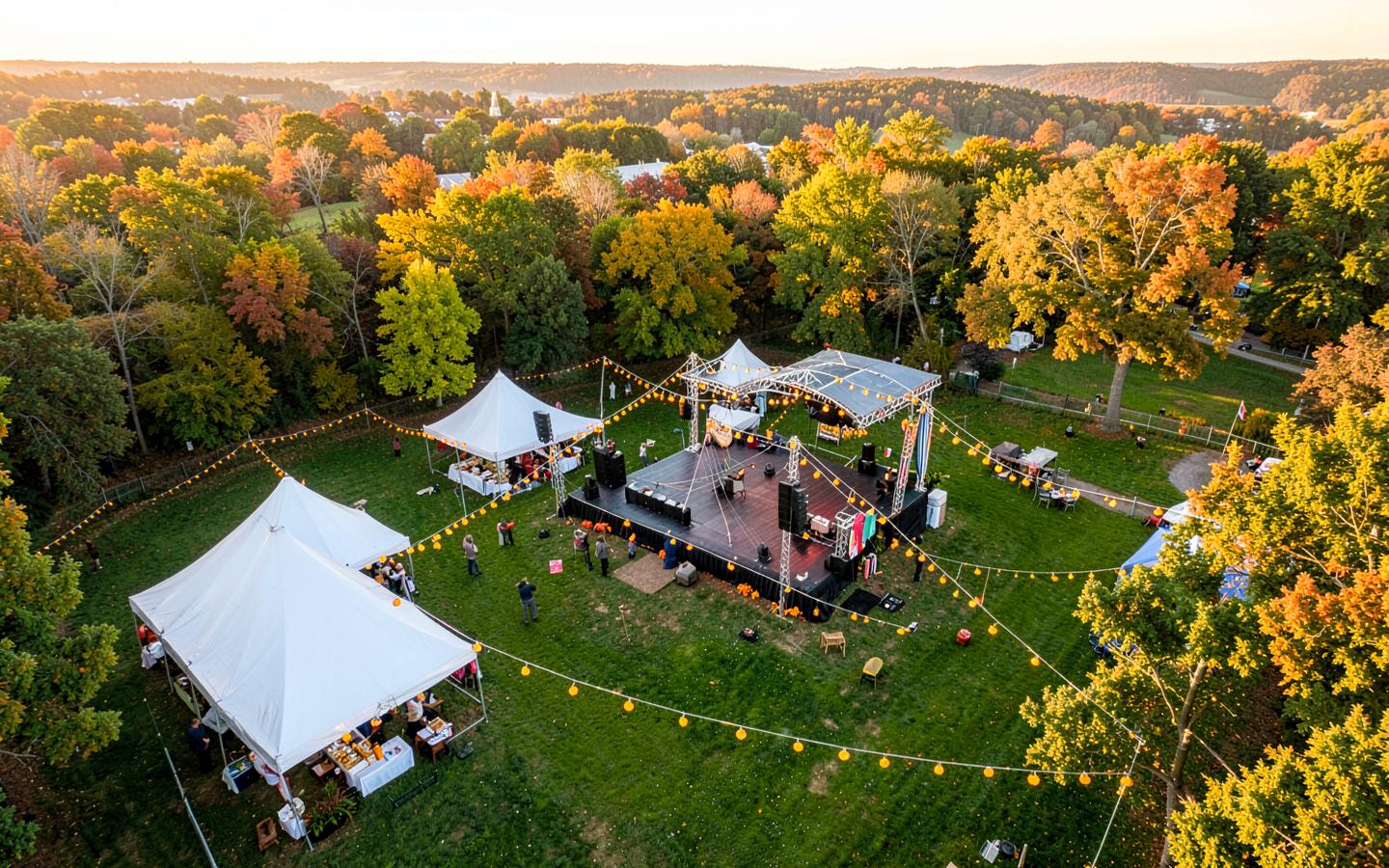 Aerial view of Country Heritage Park with a festival stage and marigold garlands